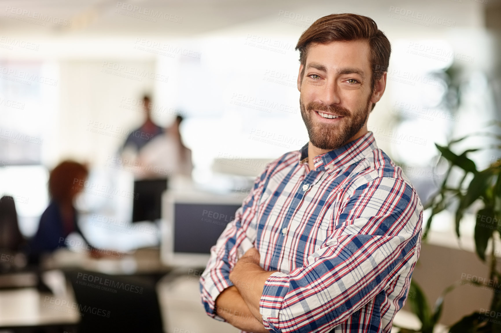 Buy stock photo Portrait of a confident young businessman standing in an office