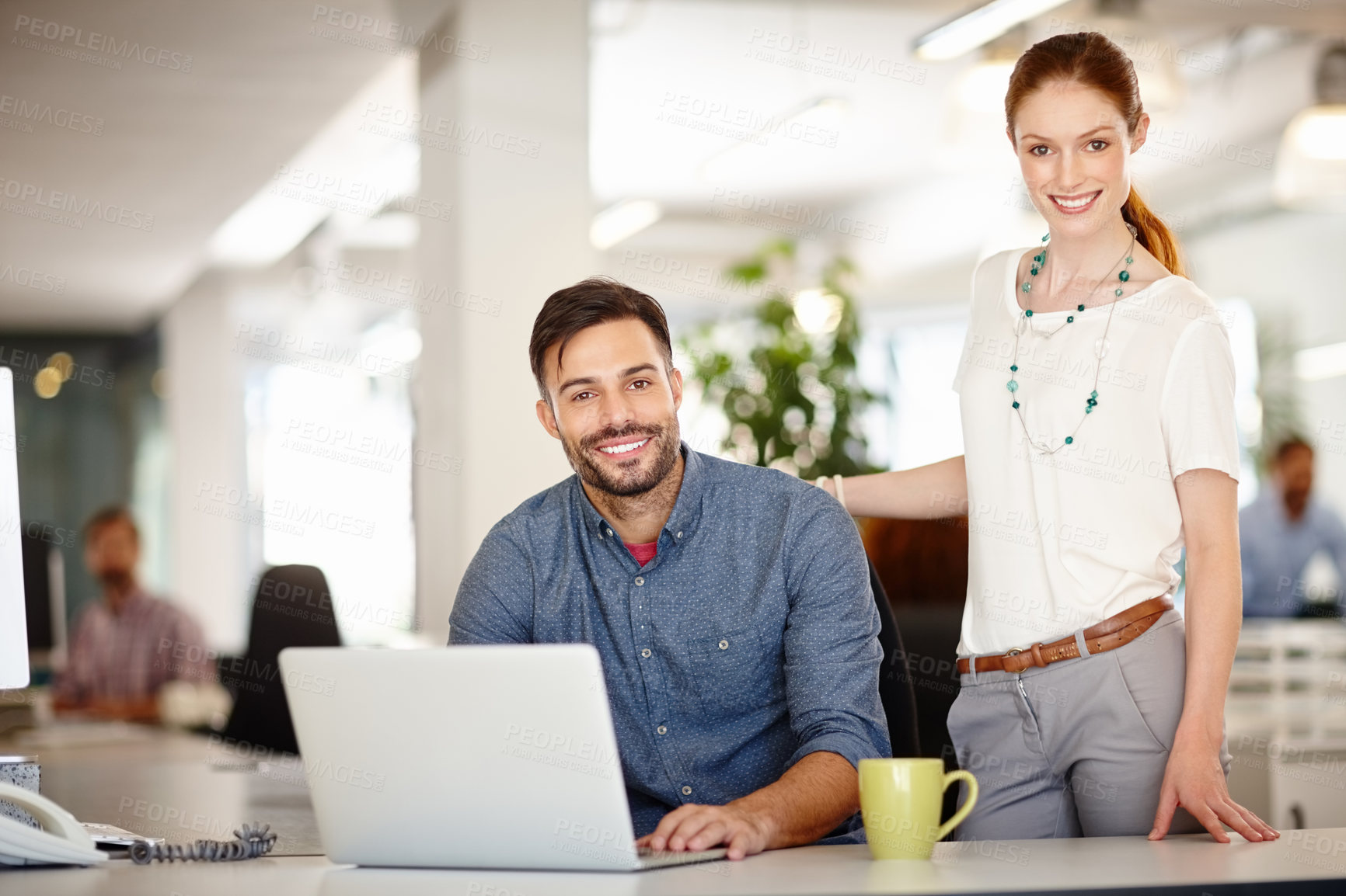 Buy stock photo Portrait of two colleagues working together in an office