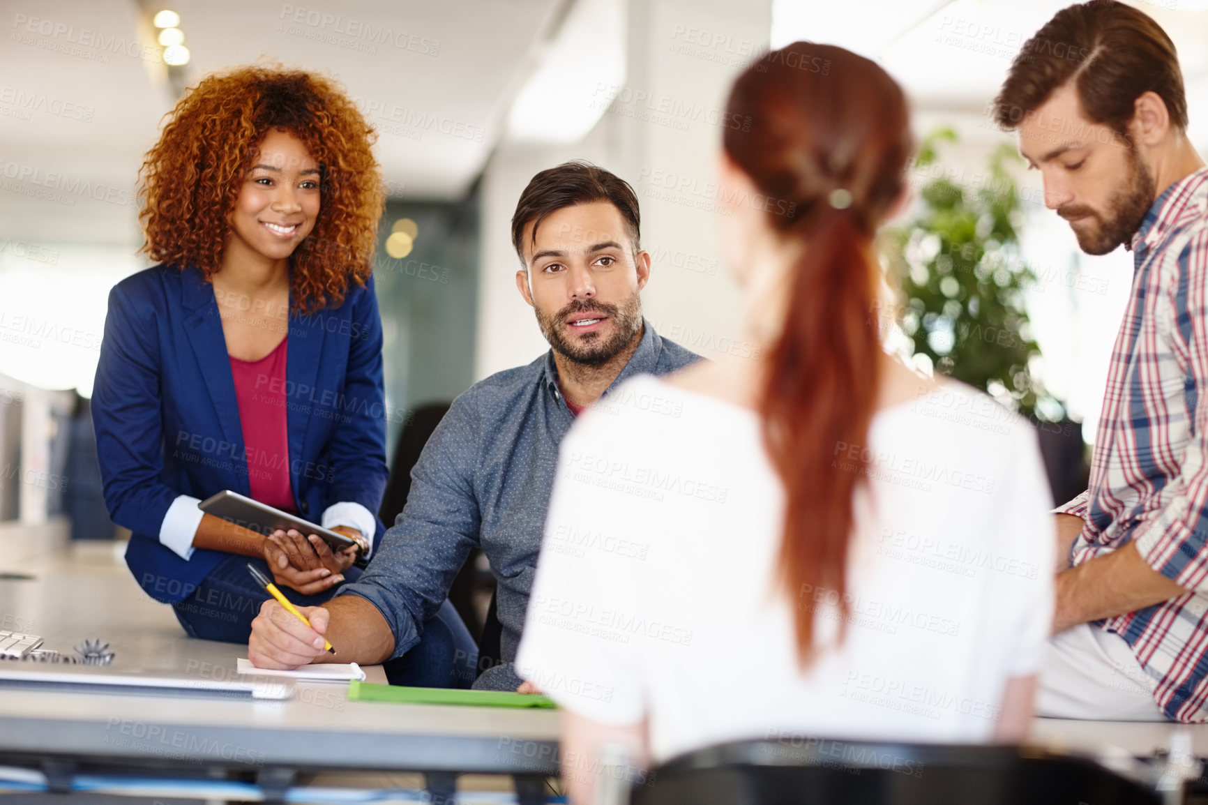 Buy stock photo Cropped shot of a group of colleagues working together in an office