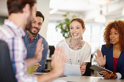 Buy stock photo Cropped shot of a group of colleagues working together in an office