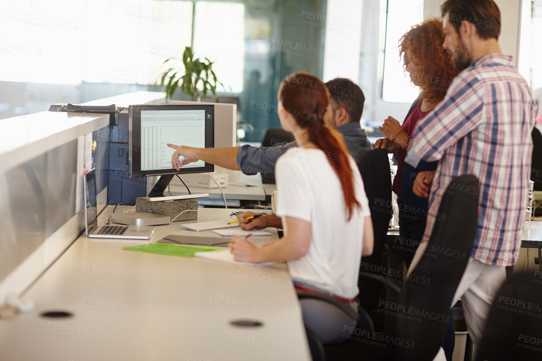 Buy stock photo Cropped shot of a group of colleagues working together in an office