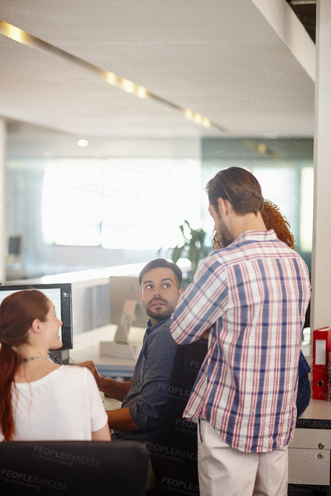 Buy stock photo Cropped shot of a group of colleagues working together in an office