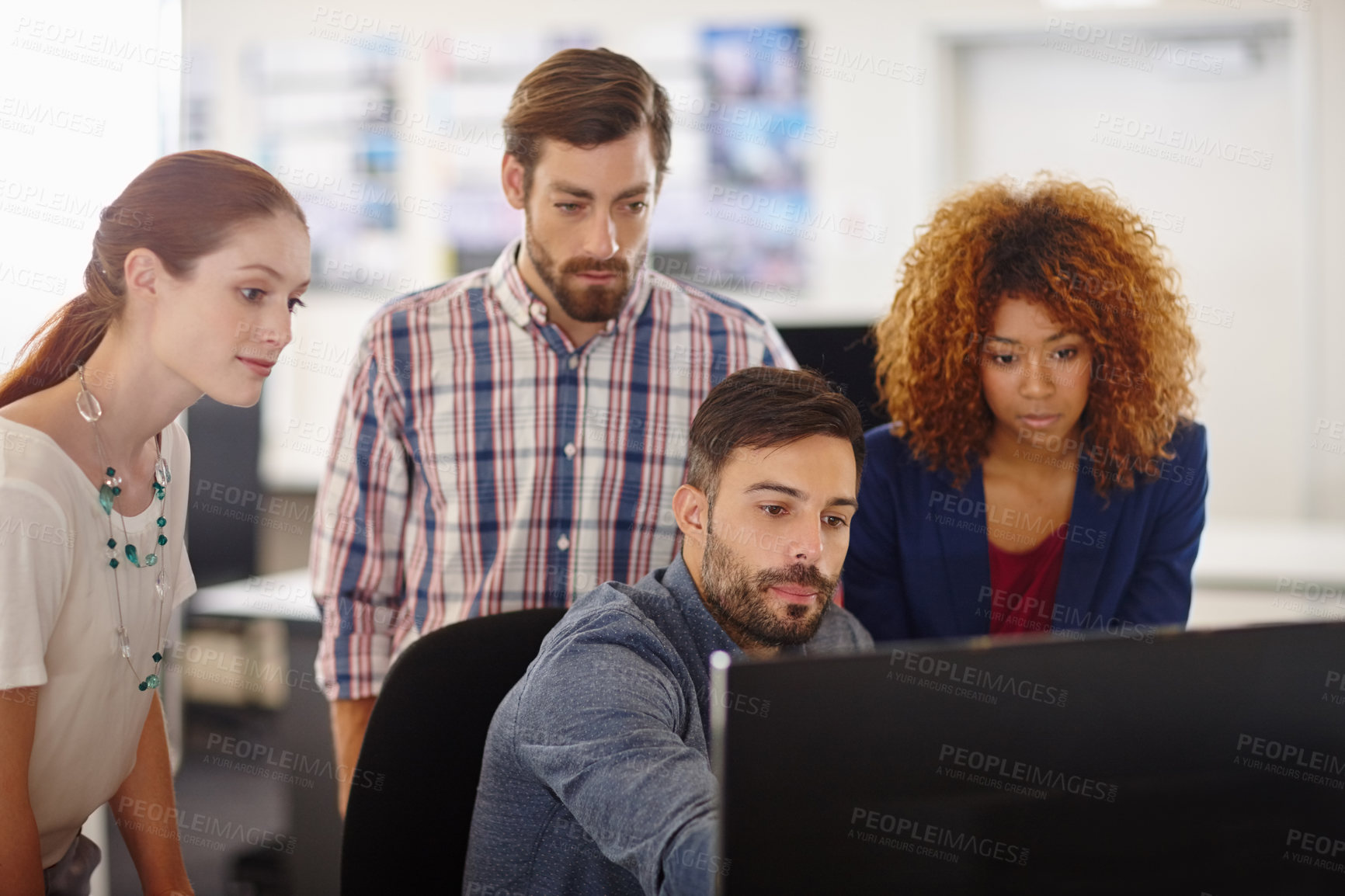 Buy stock photo Cropped shot of a group of colleagues working together in an office