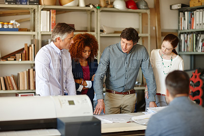 Buy stock photo Cropped shot of a group of architects working together in an office