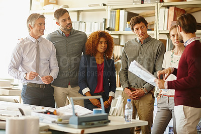 Buy stock photo Shot of a group of architects having a meeting in their office