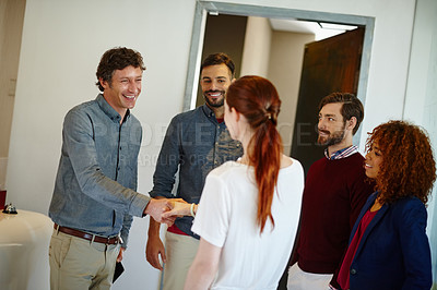 Buy stock photo Shot of a young businesswoman being introduced to her new coworkers in the office