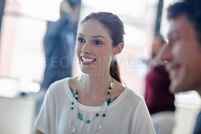 Buy stock photo Shot of a smiling businesswoman and her colleagues in the office