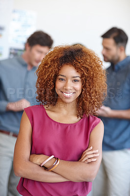 Buy stock photo Portrait of a businesswoman standing in the office with her colleagues in the background