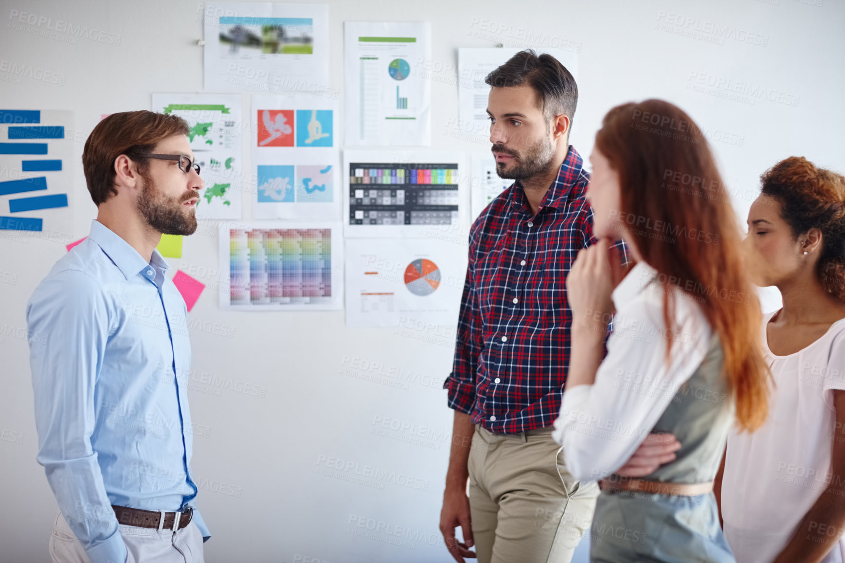 Buy stock photo Shot of a group of colleagues having a brainstorming session at work