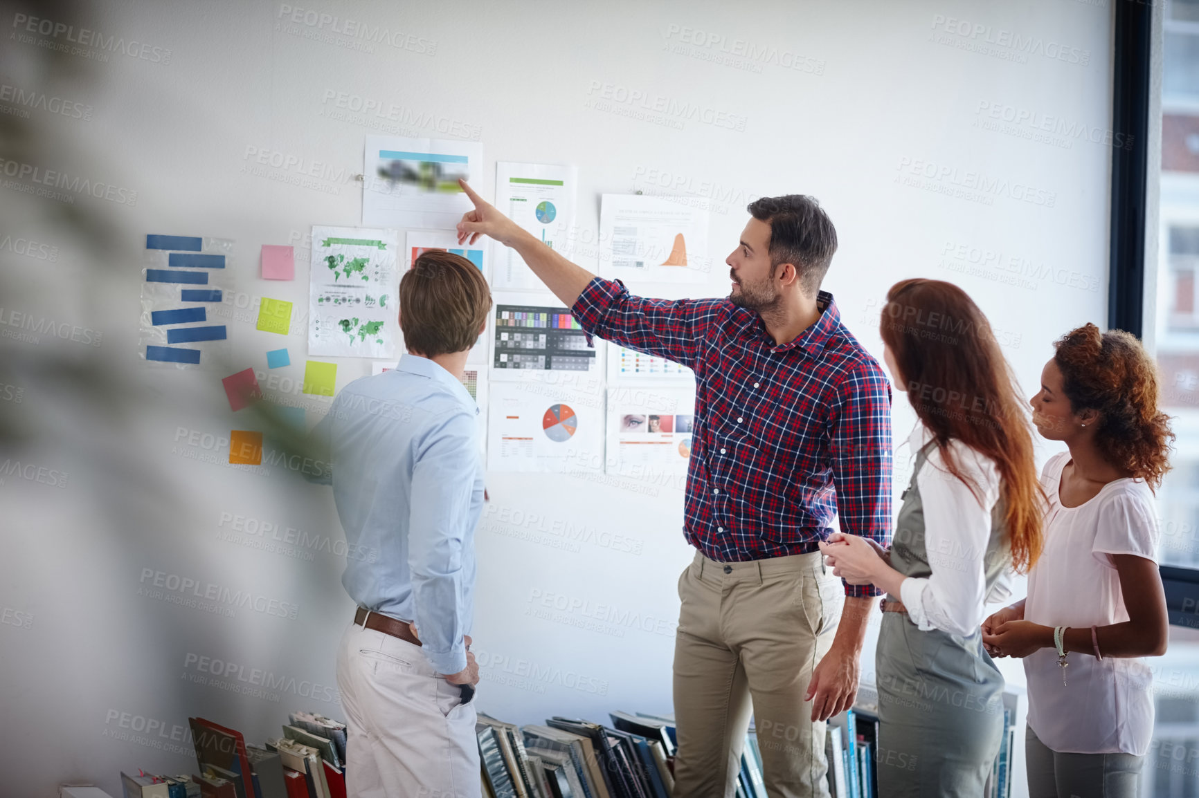 Buy stock photo Shot of a group of colleagues having a brainstorming session at work