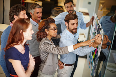 Buy stock photo Shot of a group of colleagues having a brainstorming session at work