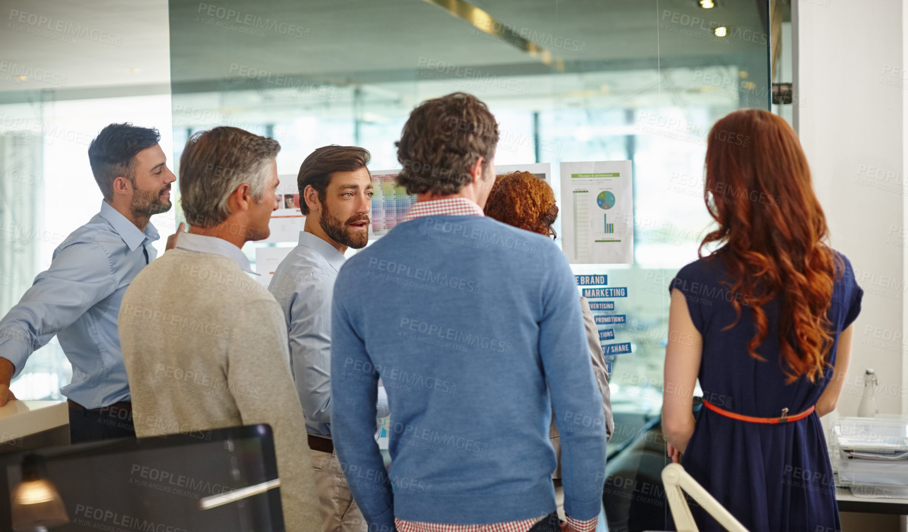 Buy stock photo Shot of a group of colleagues having a brainstorming session at work