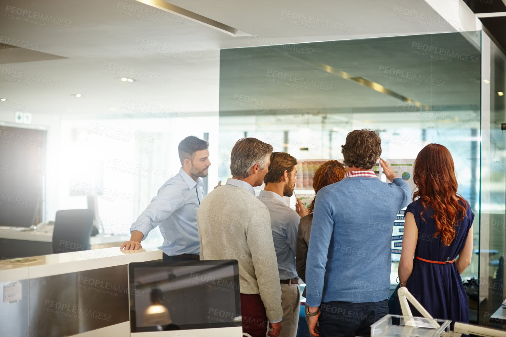 Buy stock photo Shot of a group of colleagues having a brainstorming session at work