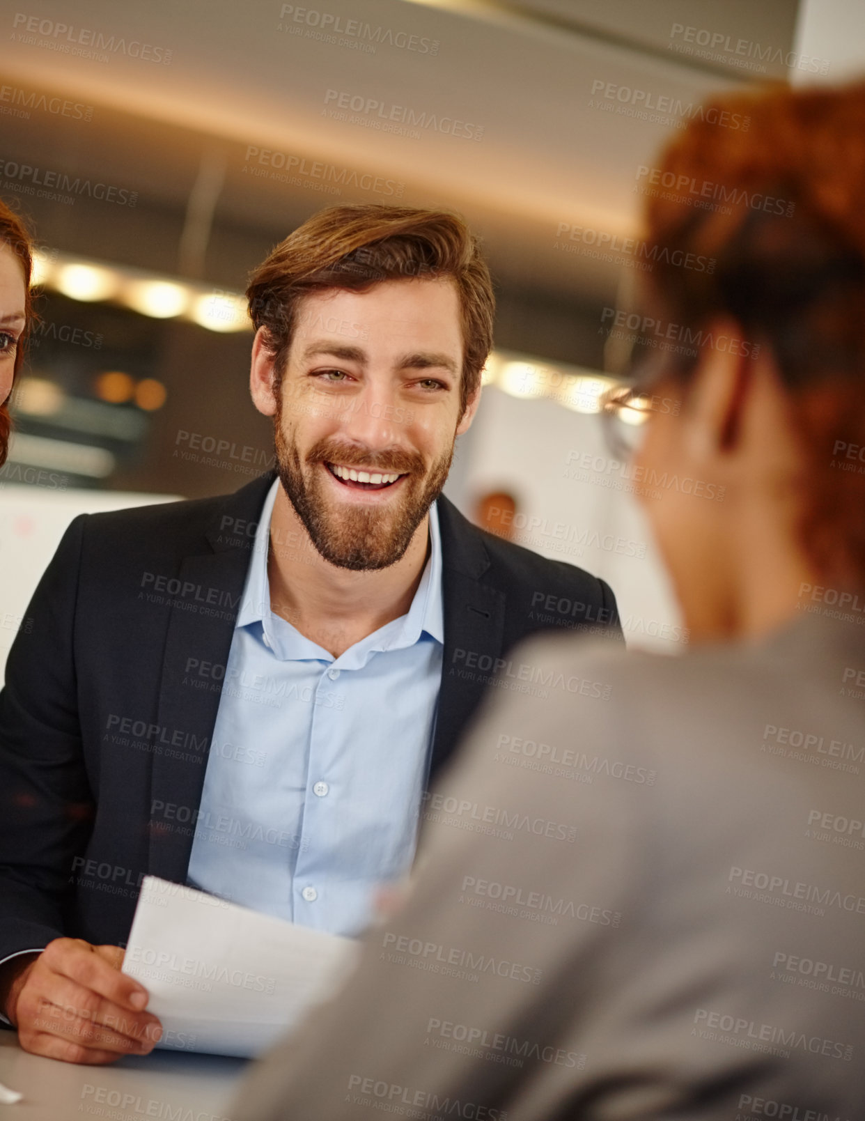 Buy stock photo Shot of a businessman having a face to face meeting with a colleague at work