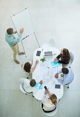 Buy stock photo High angle shot of a businessman giving a presentation in the office