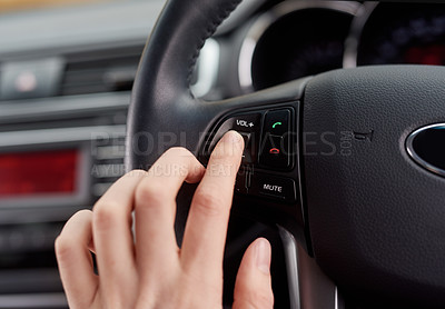 Buy stock photo Closeup shot of a driver adjusting the functions in a motor vehicle