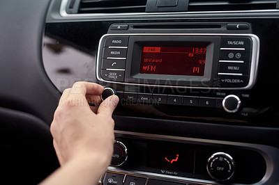Buy stock photo Closeup shot of a driver tuning a car radio