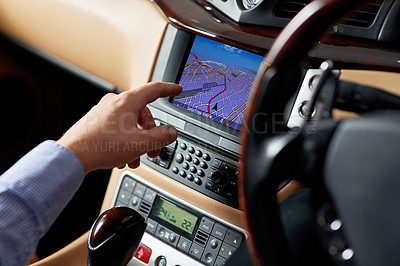 Buy stock photo Closeup shot of a driver using a car's GPS to find directions