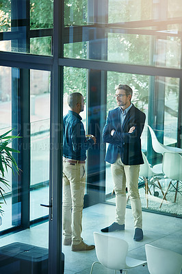 Buy stock photo Shot of an unhappy employer taking an employee to task