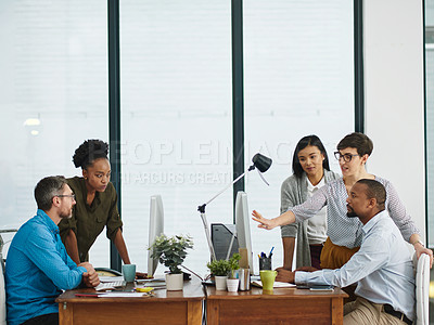Buy stock photo Cropped shot of a group of colleagues working in their office