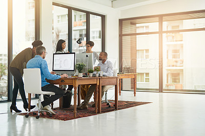 Buy stock photo Full length shot of a group of colleagues working in their office