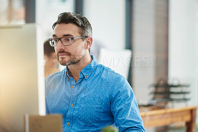 Buy stock photo Cropped shot of a businessman working in the office