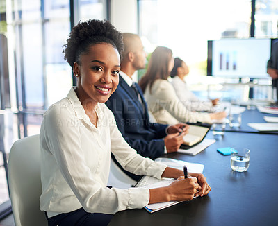 Buy stock photo Portrait of a young businesswoman sitting in a boardroom meeting with colleagues
