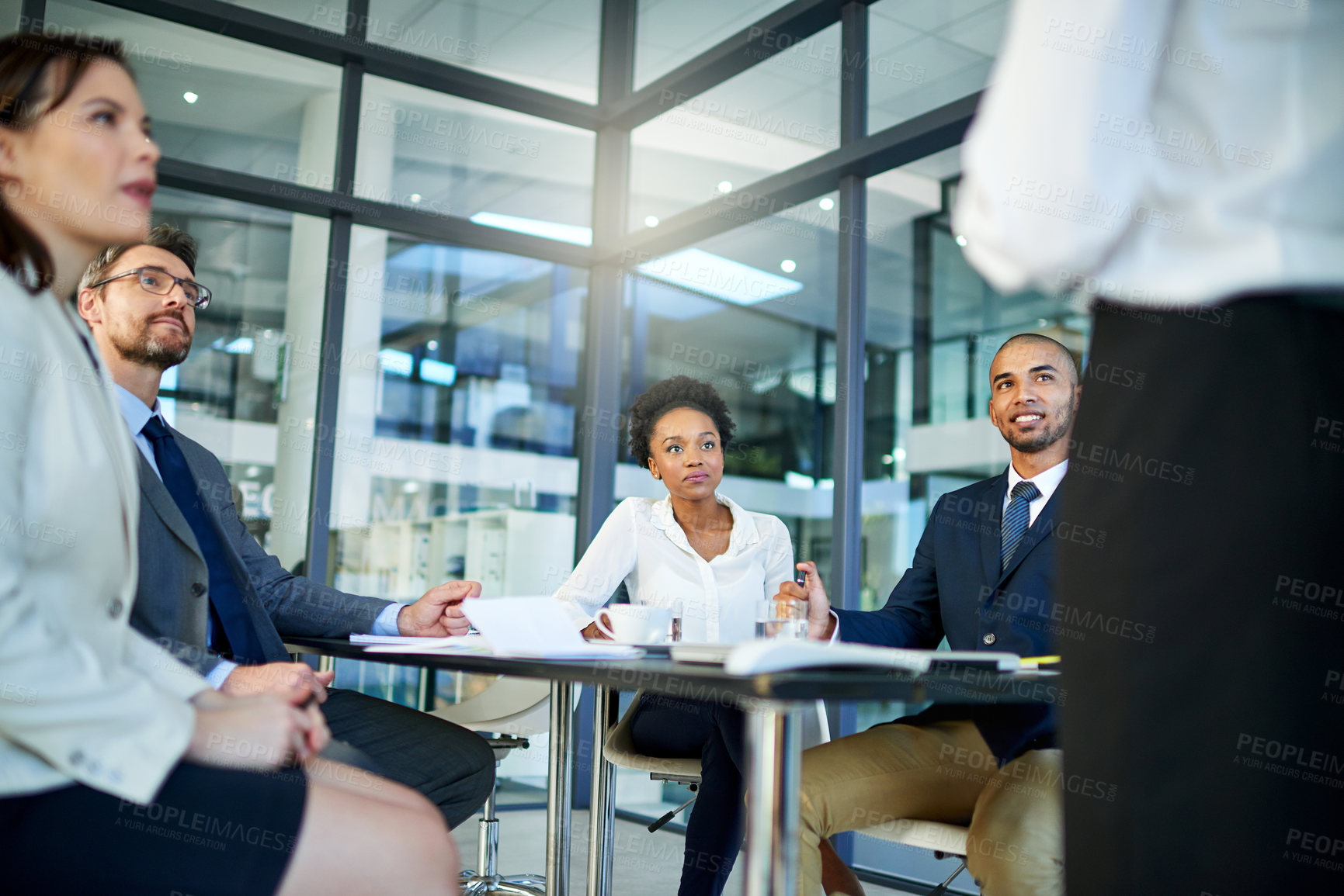 Buy stock photo Business people, meeting and discussion with team in presentation for corporate strategy or coaching at office. Speaker talking to group of employees in conference for company profit, stock or budget