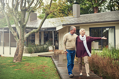 Buy stock photo Senior couple, garden and walk with smile, hug and together with love, bonding and freedom in winter morning. Old woman, happy man and embrace in backyard in retirement, nature and outdoor with chat