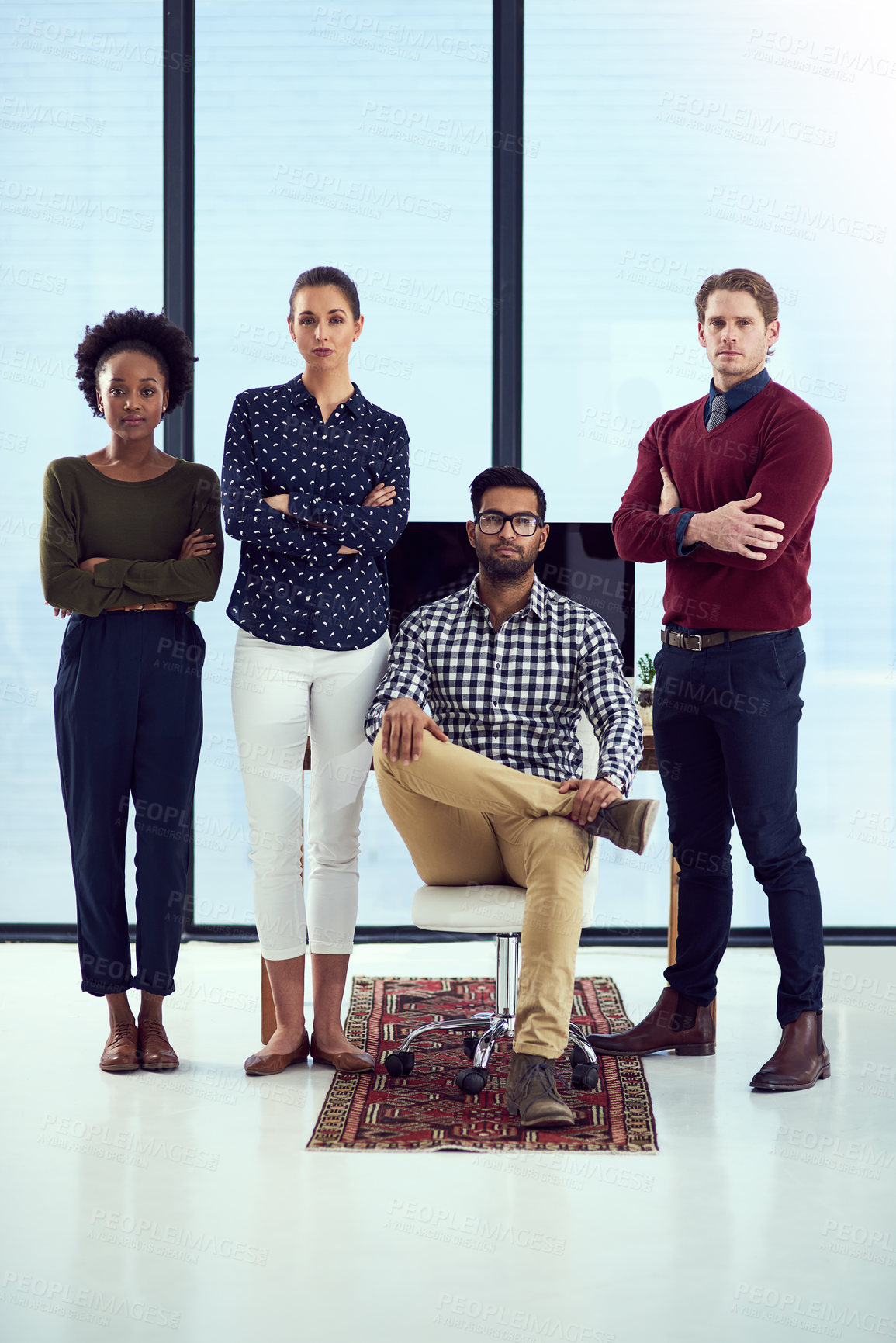 Buy stock photo Portrait of a group young designers at a work station in front of a window