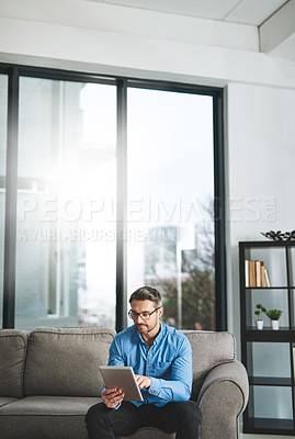 Buy stock photo Man, tablet and typing in lounge, online and research of genre in home and remote working. Living room, digital and screenwriter with story to write in apartment, person and creative for ebook