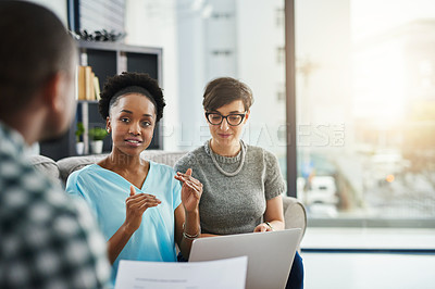 Buy stock photo Shot of businesspeople having a discussion in the office