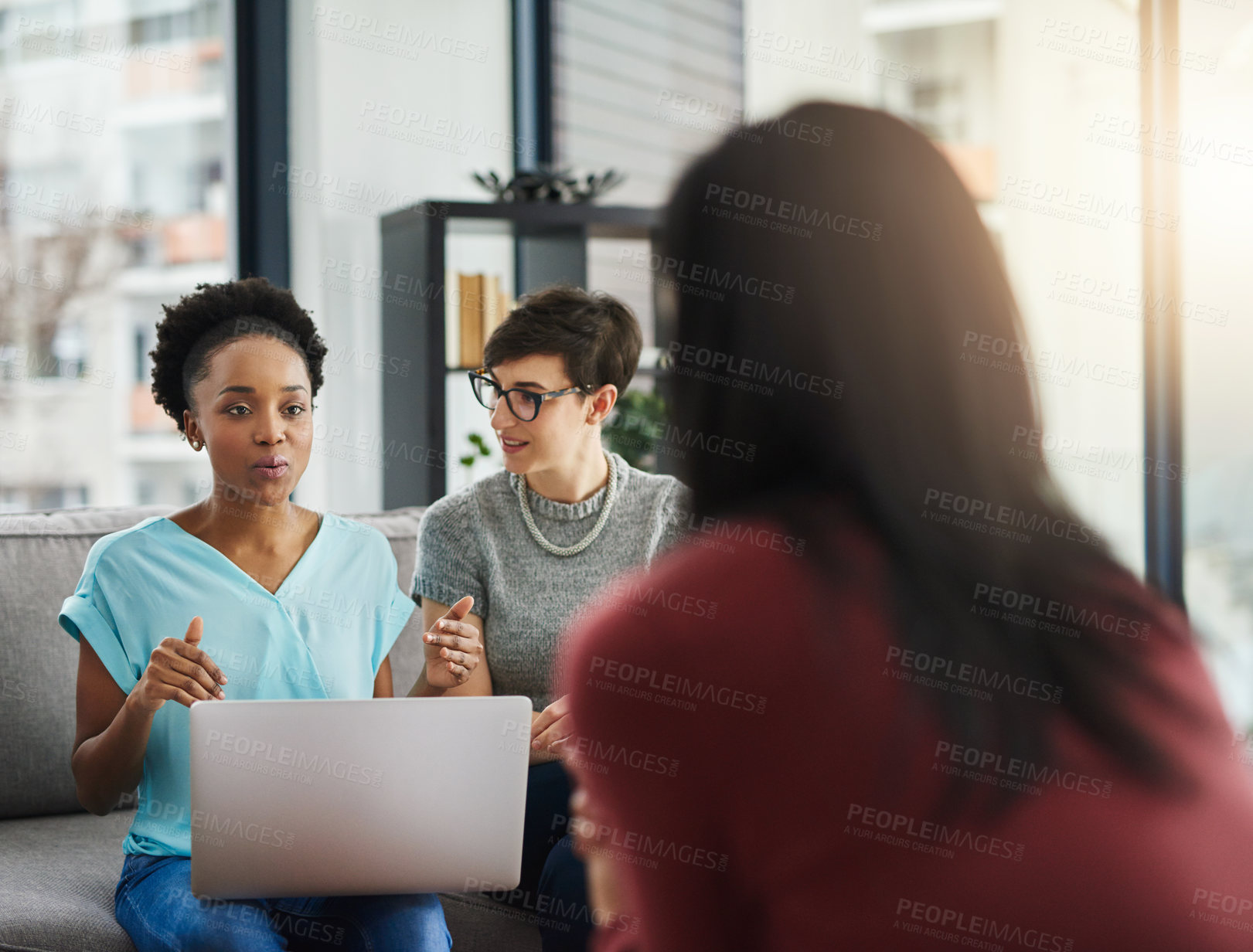 Buy stock photo Shot of businesspeople having a discussion in the office