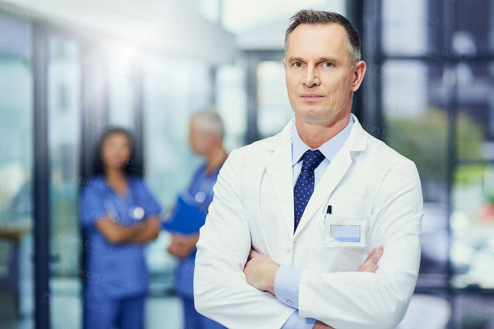 Buy stock photo Healthcare, mockup and portrait of doctor with confidence in hospital, support from leader in medical career. Health care, pride and medicine, confident man or professional surgeon in workplace space