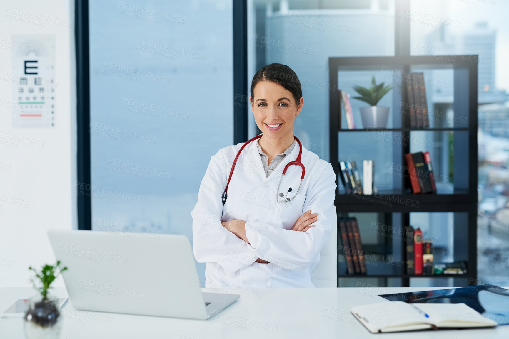 Buy stock photo Female doctor, laptop and confident in portrait for patient, medicare or healthcare in clinic. Woman smile, computer and happy at desk for research, consulting or online communication for telehealth