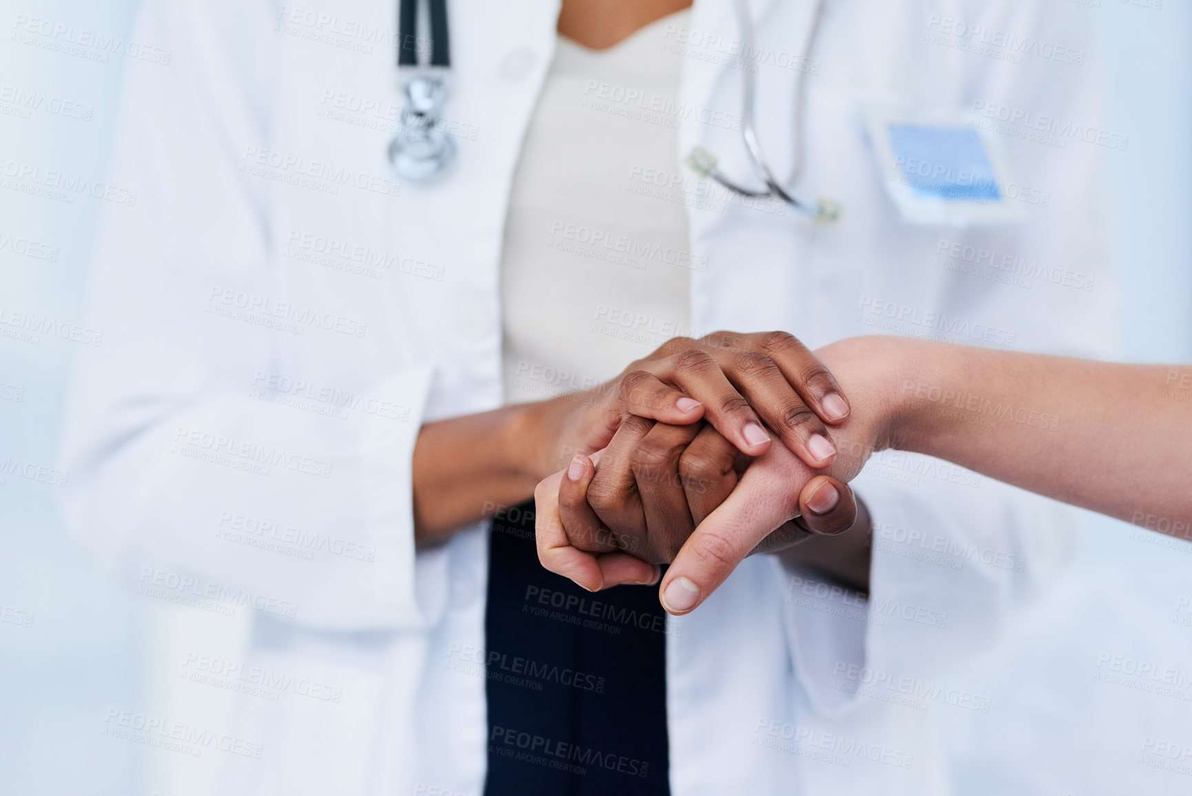 Buy stock photo Cropped shot of a female doctor consoling a patient
