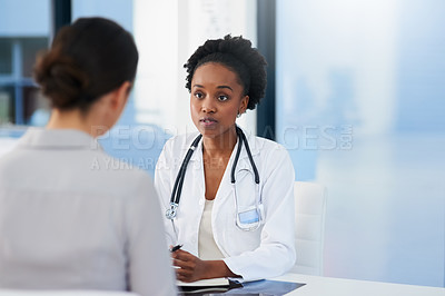 Buy stock photo Cropped shot of a female doctor talking to a patient in her office