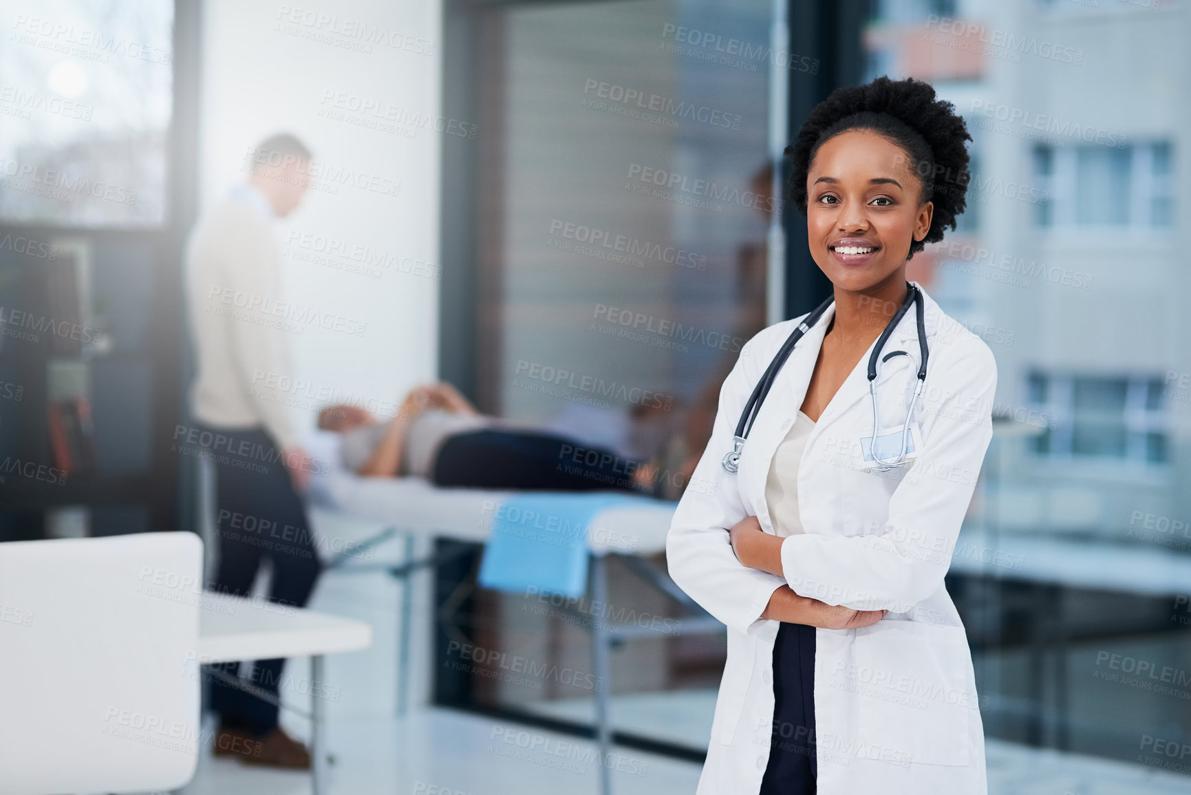 Buy stock photo Cropped portrait of a female doctor standing in her office with patients in the background