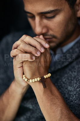 Buy stock photo Closeup shot of a young man praying with his eyes closed