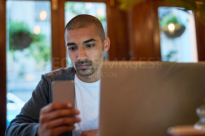 Buy stock photo Laptop, phone and businessman in cafe working on creative web design for startup company. Technology, freelancer and male copywriting editor with computer and cellphone for online research project.