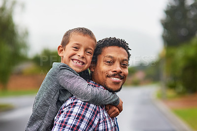 Buy stock photo Portrait of a father and son enjoying a day outside together