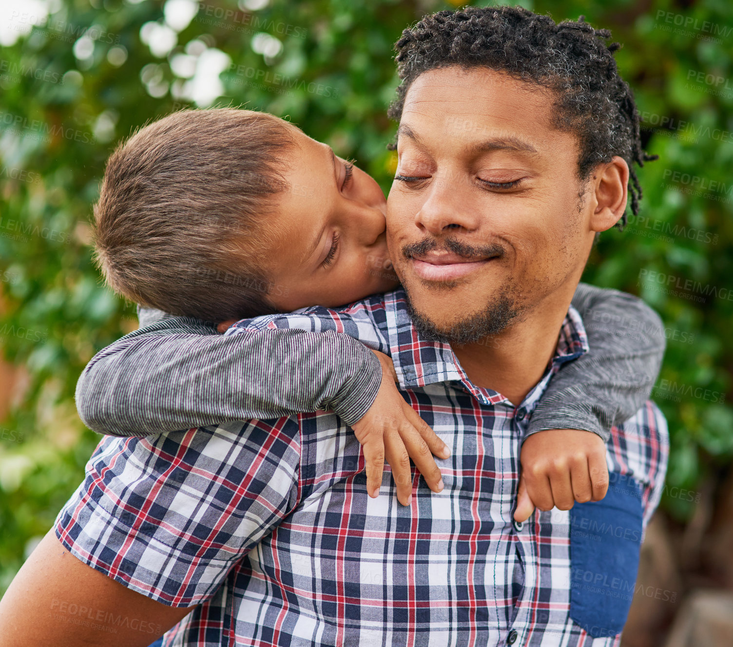 Buy stock photo Father, kiss and child in backyard for love, care and happiness for piggy back. Black man, boy and embrace in garden for bonding, family and together in park for holiday or vacation in spring time 