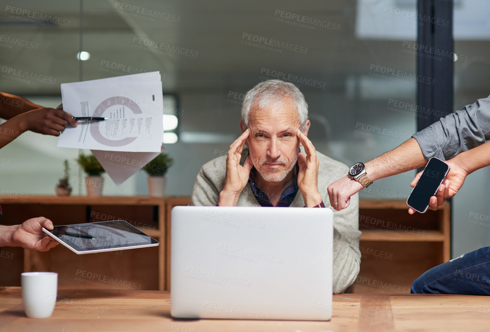Buy stock photo Portrait of a stressed out businessman surrounded by staff with more work