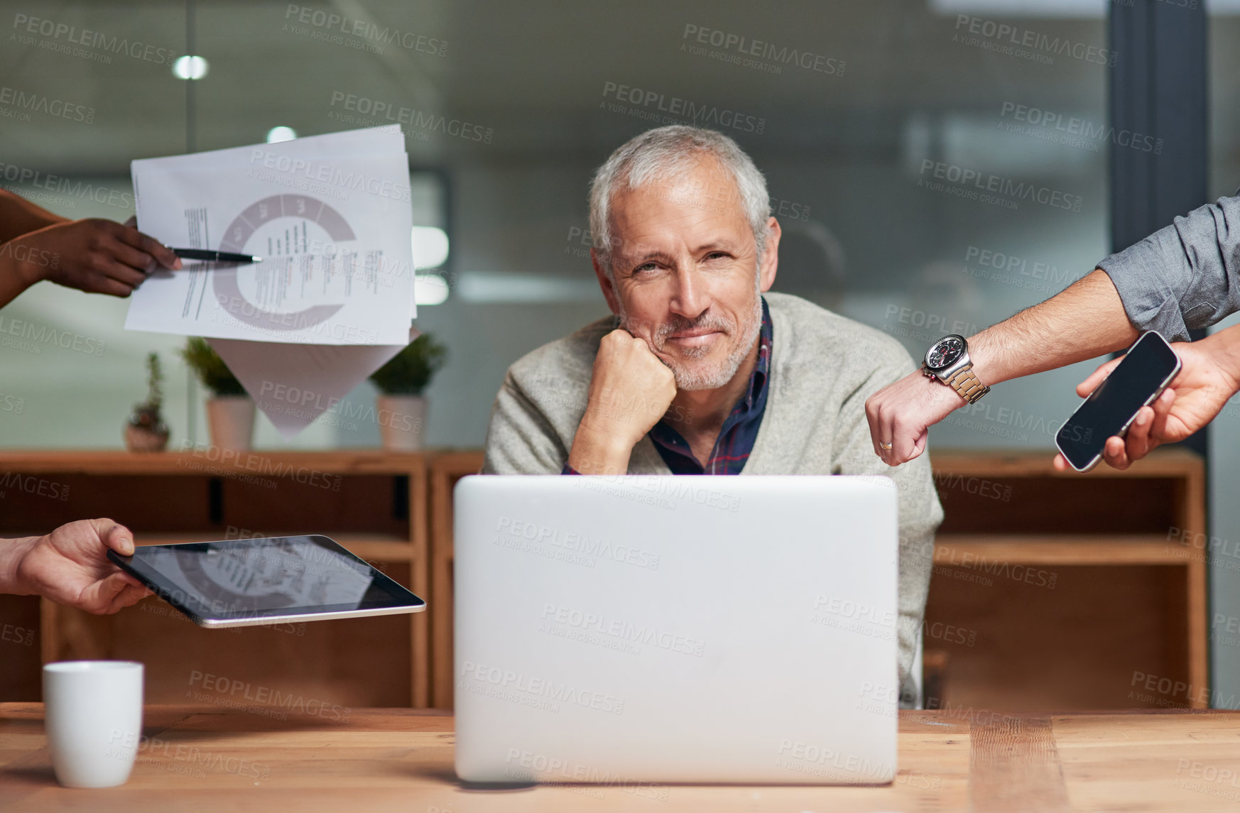 Buy stock photo Portrait of a smiling businessman surrounded by staff with more work