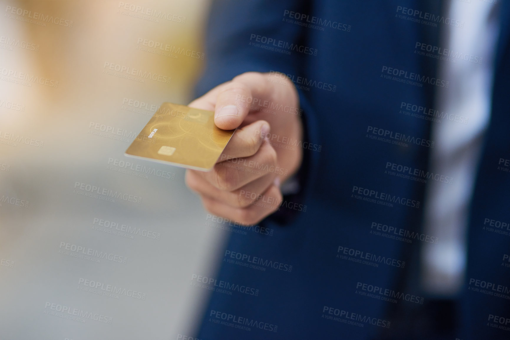 Buy stock photo Cropped shot of an unrecognizable businessman holding out a credit card