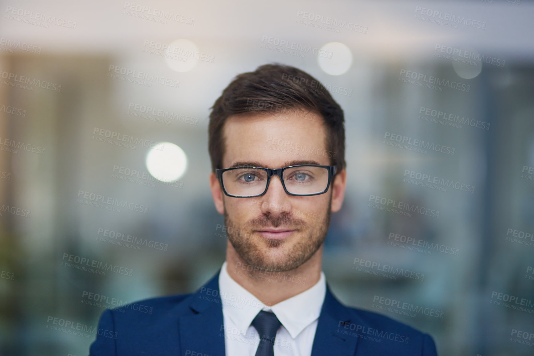 Buy stock photo Portrait of a young businessman standing in his office