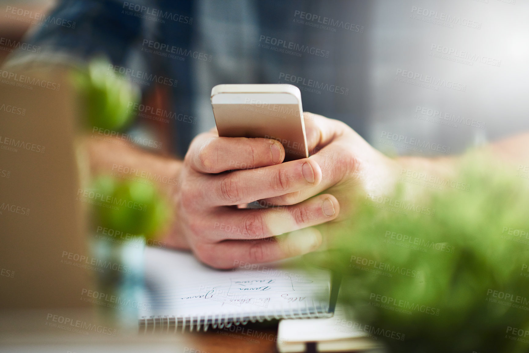 Buy stock photo Closeup shot of a businessman texting on a cellphone at work