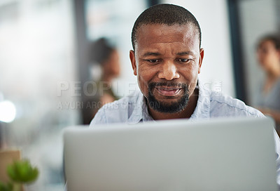 Buy stock photo Cropped shot of a mature businessman working on a computer in an office