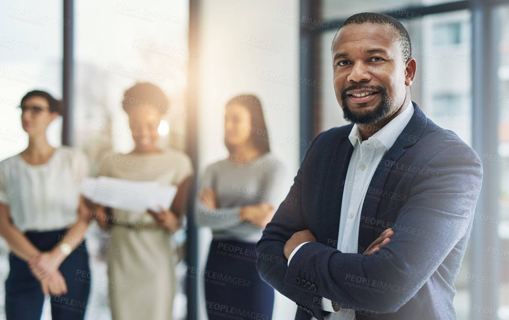 Buy stock photo Cropped shot of a group of businesspeople standing in the office