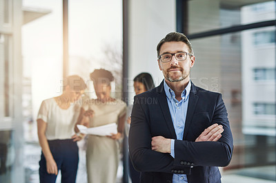 Buy stock photo Cropped shot of a group of businesspeople standing in the office